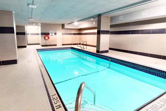 A rectangular pool with a depth marker reading 12.5 feet.