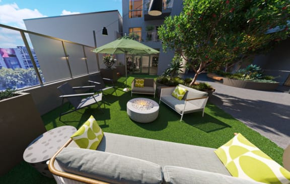 a roof terrace with couches and chairs on a sunny day