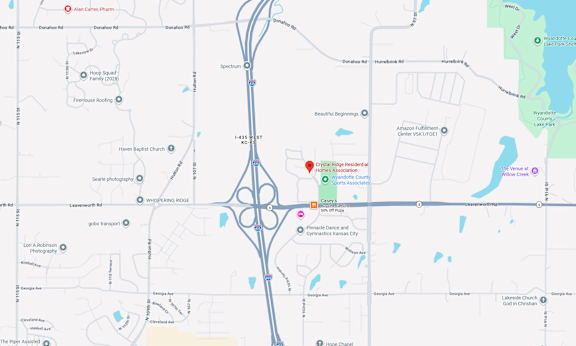 A map with a red pin on a location near a highway.