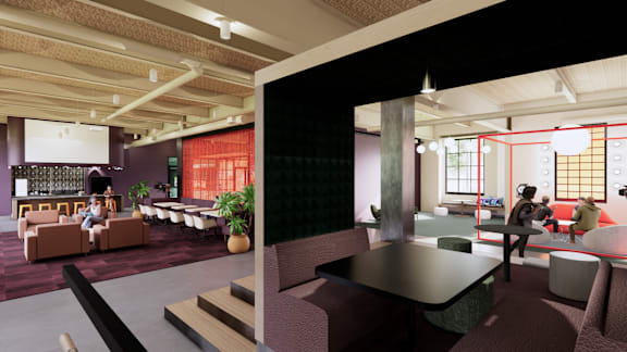 A modern office space with a bar area and seating.
