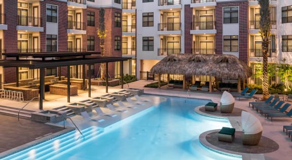 swimming pool and outdoor lounging area at Tinsley on the Park apartments