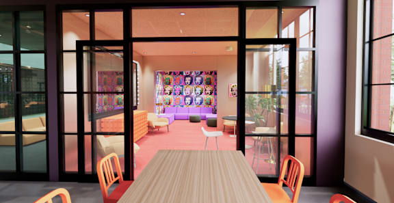 A room with a long table and chairs with a purple wall and a window. at University Commons in Pittsburgh, PA