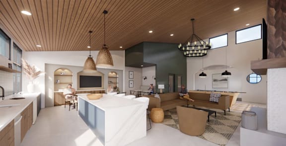 A modern kitchen with a large island and pendant lights.