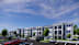 A modern apartment complex with a parking lot in front.