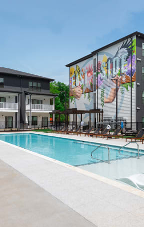 our apartments offer a swimming pool with a mural on the side