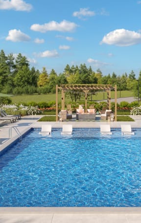 a swimming pool with lounge chairs around it and a resort style ceremony in the background