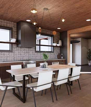 A modern kitchen with a wooden ceiling and a dining table with chairs.