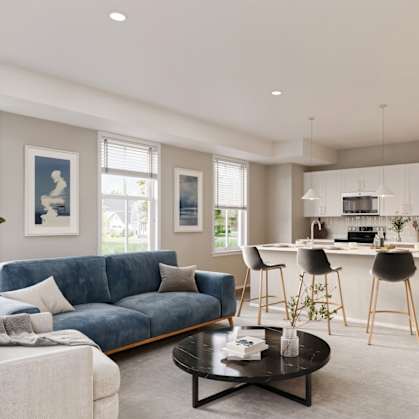 A modern living room with a blue sofa and a coffee table.