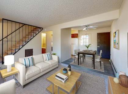 a living room with a couch and a table