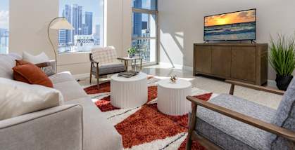 a living room with a couch and a tv