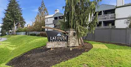 A garden with a sign that says Latitude.