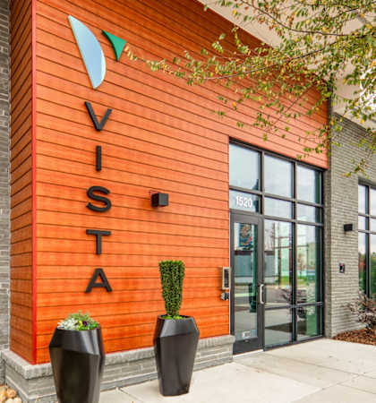 A building with a sign that says Vista on it.