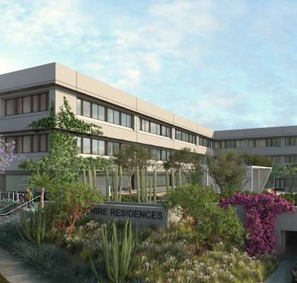 Modern building with a parking garage in front at 701 Hudson, Los Angeles, CA