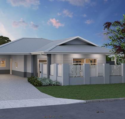 A modern house with a grey roof and white picket fence.