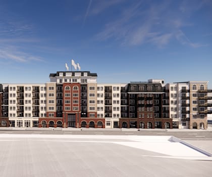 a view of a large building with a blue sky in the background