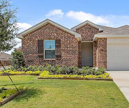 a house with a driveway and a garage door