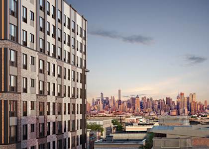 a view of the nyc skyline from a high rise building