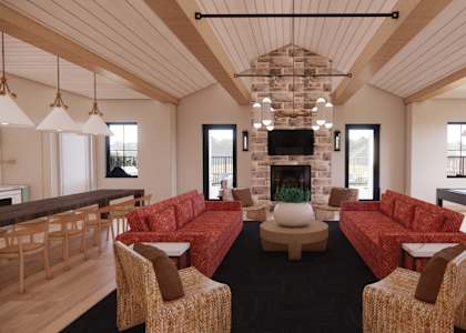 a rendering of a living room with furniture and a fireplace at Sandhill Parkway Townhomes Apartments, East Bethel, Minnesota