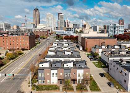A cityscape with a mix of residential and commercial buildings.