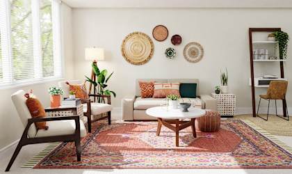 a living room with furniture and a rug