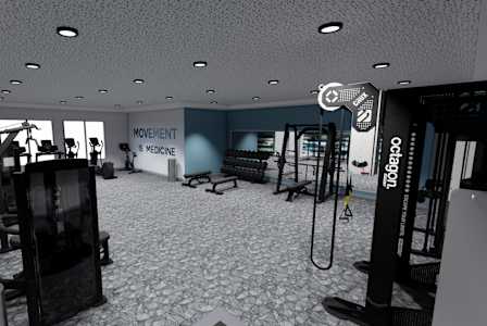A gym with a variety of equipment including weights and machines.