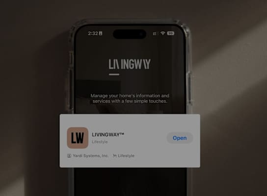 A phone displaying the Livingway Lifestyle app logo.