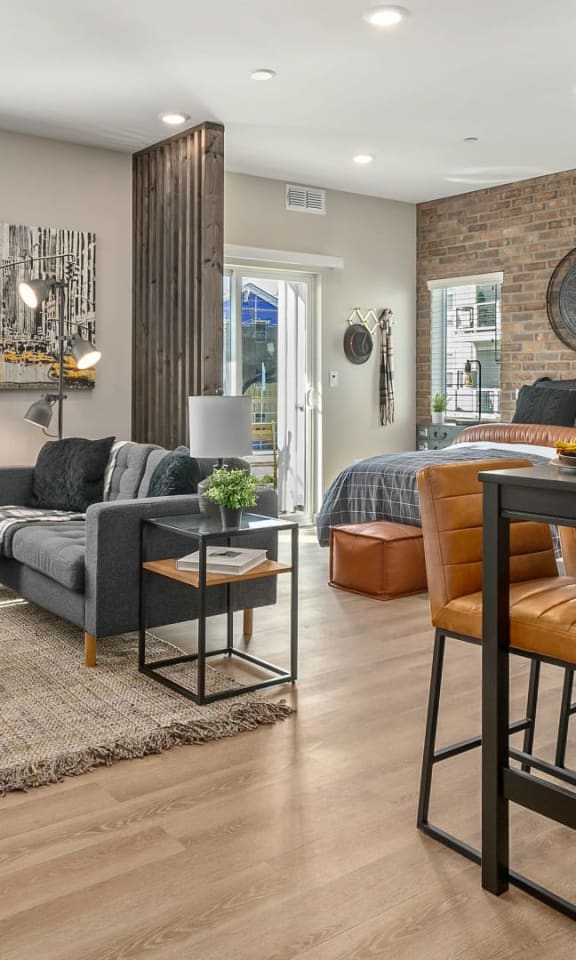 a living room with a bar and a dining room