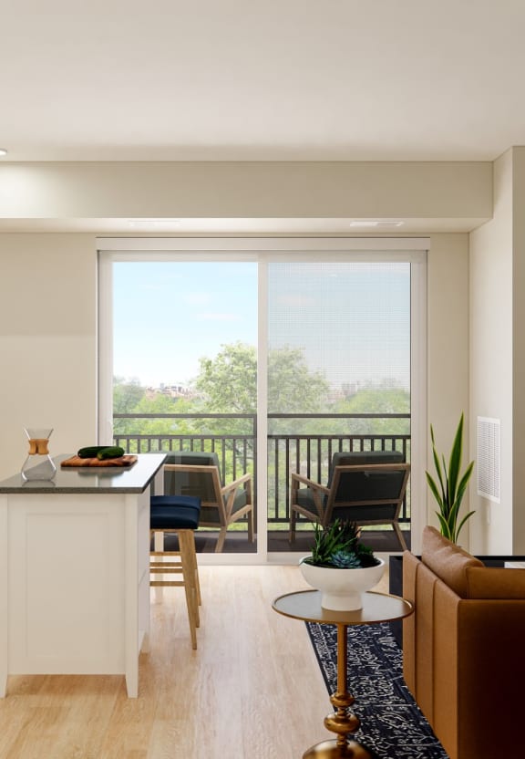 a kitchen and living room in a 555 waverly unit at The Gateway at West Lake Quarter in Minneapolis, MN