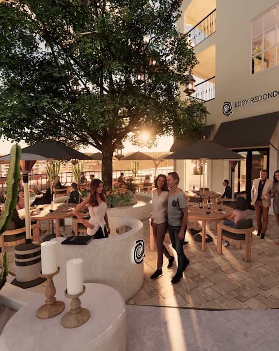 a patio with a fireplace and a seating area