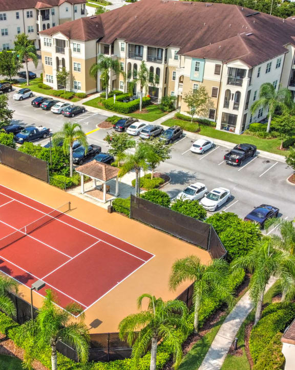 an aerial view of a tennis court in the middle of a street at Hacienda Club Apartments in Jacksonville, FL