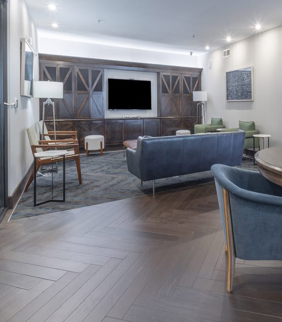 a living room with a table and chairs and a television at The Haven, Atlanta Georgia