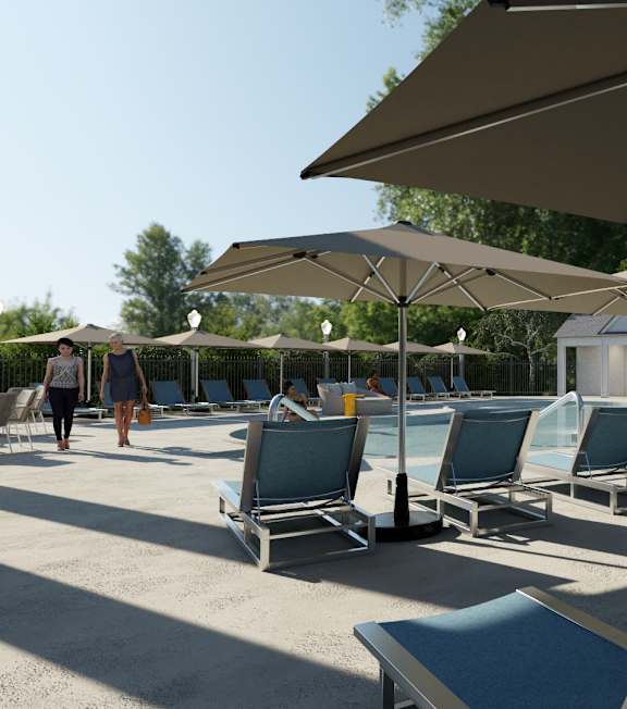 A row of sun loungers are arranged in a row under umbrellas.
