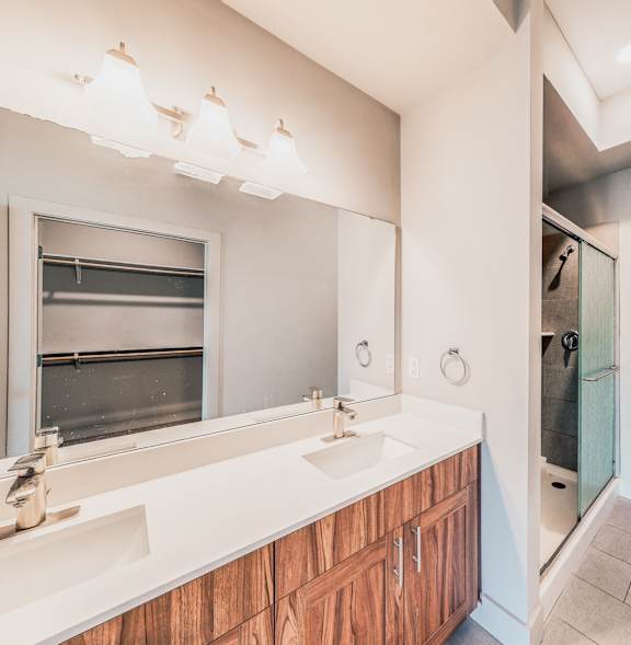 a bathroom with a sink and a toilet and a shower