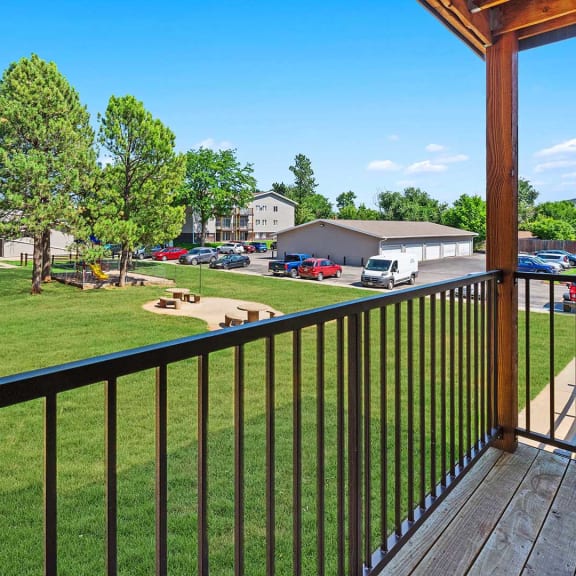 a view of the yard from the balcony of a house