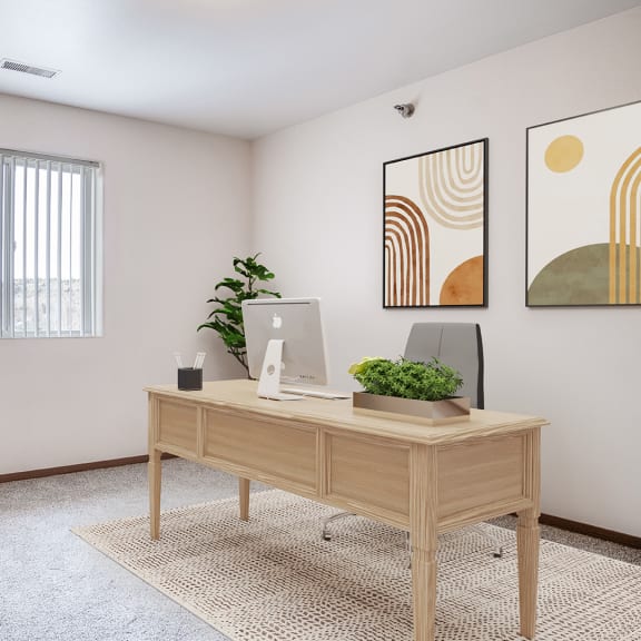 an office with a desk and a chair and a window