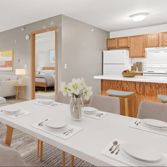 a living room and dining room with a white table and chairs