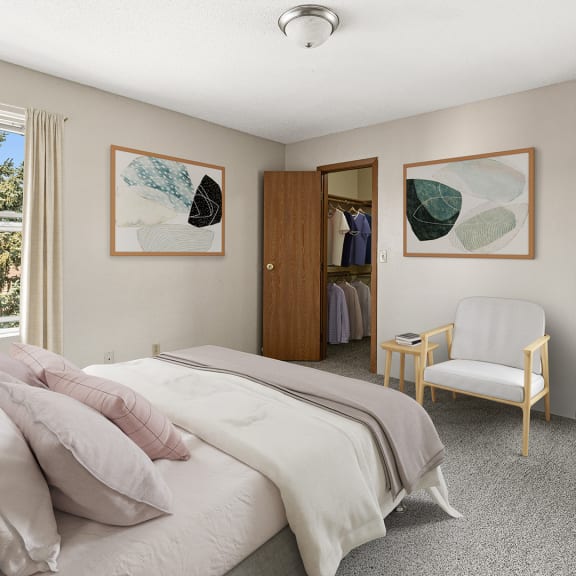 a bedroom with a bed and a chair and a closet