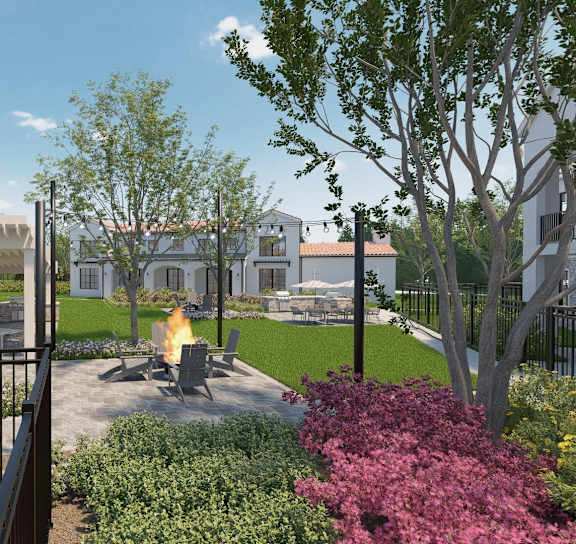A beautiful garden with a fire pit in the middle of it. at Stella Luxury Apartment Homes in San Tan Valley, AZ