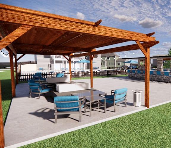 A wooden pergola with blue chairs and a table is set up on a patio. at The Beacon, Alabama, 35816