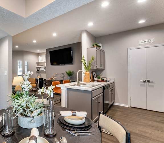 A modern dining room with a table set for two. at Westover on 80, Mesquite, 75150