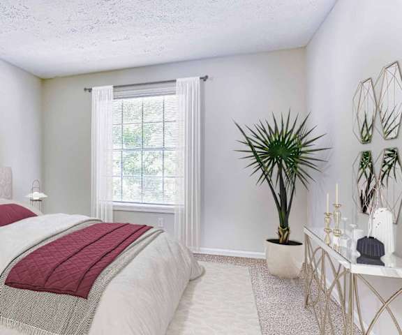 a white bedroom with a bed and a window at Elea Apartments in Marietta, GA