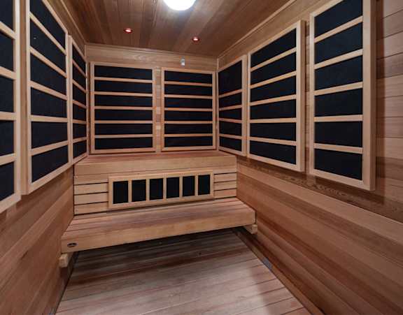 Sauna with wooden walls and benches at Tuscan Highlands, Nevada