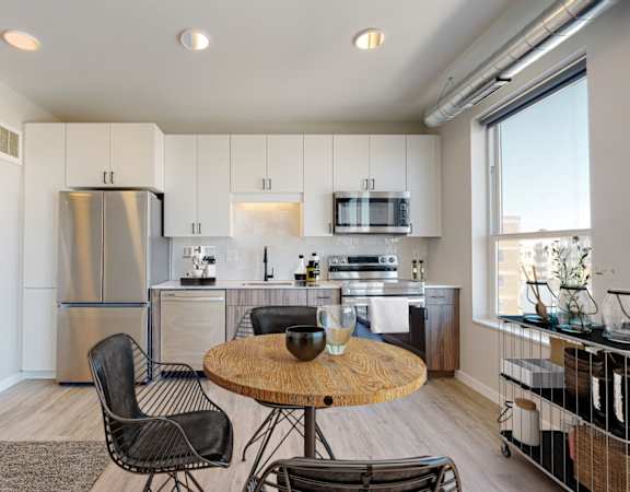 a kitchen and dining area in a 555 waverly unit