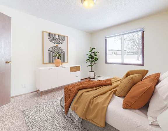 a bedroom with a large bed and a large window