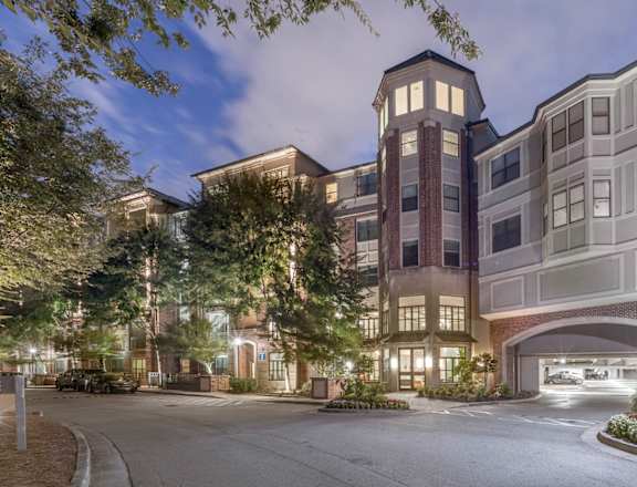 a street view of an apartment building at night at The Hendrix, Atlanta, GA, 30329