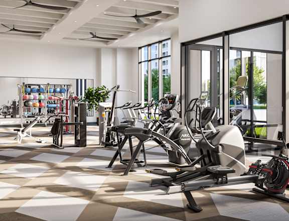 Gym with cardio machines and weights on a checkered floor
