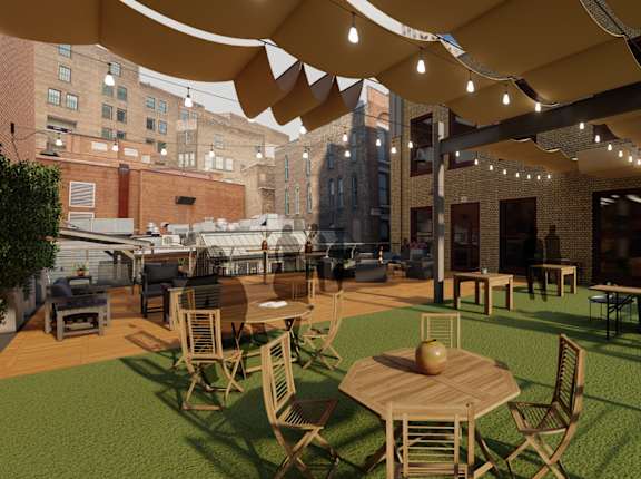 A patio with tables and chairs under a canopy. at Lofts at 629, Ohio, 44114