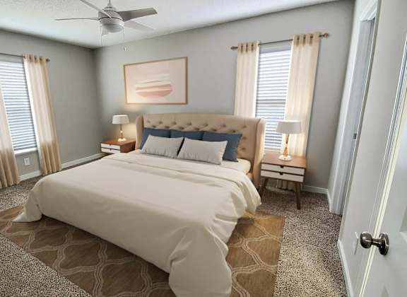 a bedroom with a bed and two windows at Planters Trace, Charleston, SC 29414