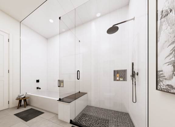 A bathroom with a walk-in shower and a bench.