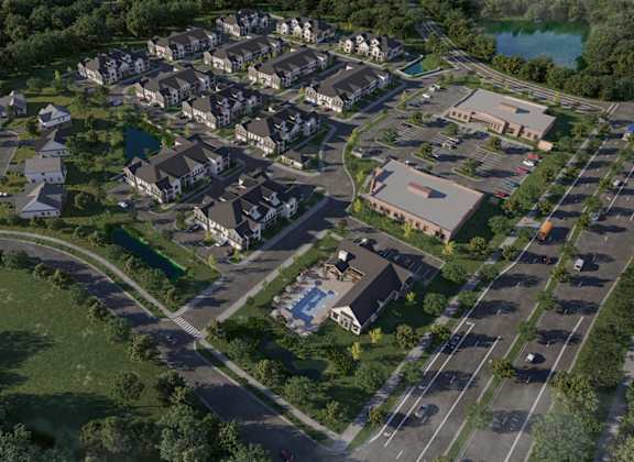 A bird's eye view of a residential area with houses and a swimming pool.
